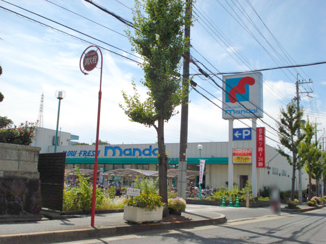 万代倉治店写真